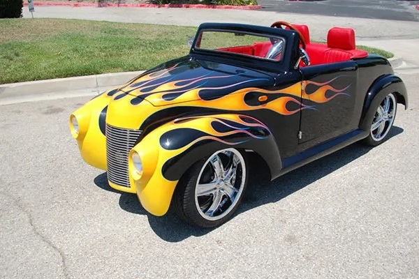 Black 39 Roadster with Yellow Flames affordable golf cart rental, golf cart rent massachusetts