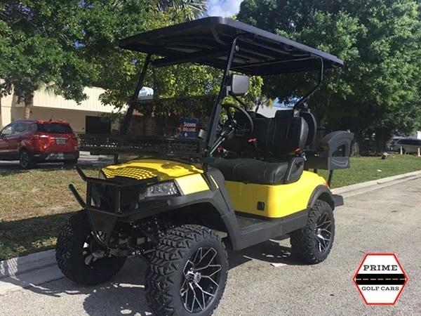 Yellow Aluma 4 Passenger Lifted Golf Cart affordable golf cart rental, golf cart rent massachusetts